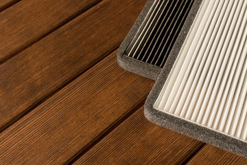 New and old car air filter. Close up.