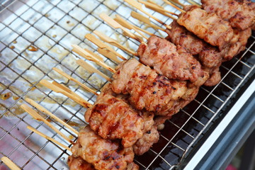 Street Food Thailand. Barbecue Pork Toast Grill or Grilled Pork with Sweet Spicy Sauce. Grilled Pork for sale at Fresh market in Thailand