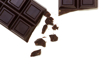 Broken chocolate bar isolated on white