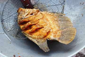 Street Food Thailand. Deep Fried Fish at Fresh market in Thailand