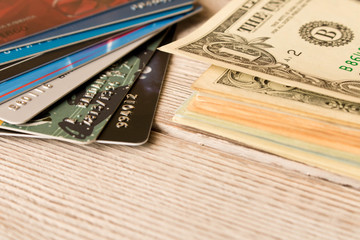 Credit cards and cash dollars. The concept of funding. Selective focus.