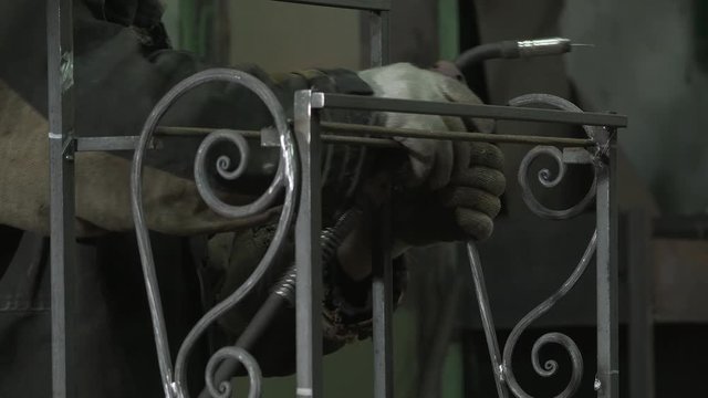 Blacksmith Assesses Strength And Symmetry To Connect The Last Detail