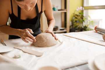 Obraz na płótnie Canvas Close up of a woman making ceramic and pottery