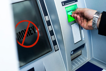 withdrawing money from an ATM. using an ATM instead of a bank. no money
