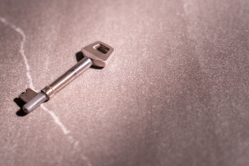 A key and stone background.