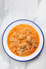 rice with fish and tomato on dish