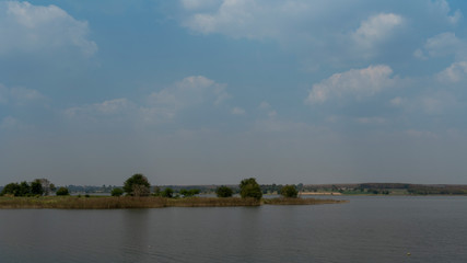 Traveling nature reflections of grass and trees beautiful of reservoir on day at Ang Kep Nam Dok Krai,Mae Nam Khu, Pluak Daeng District, Rayong Thailand.