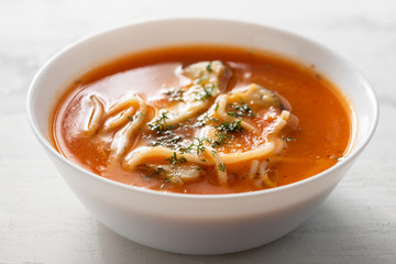 fish soup in the white bowl