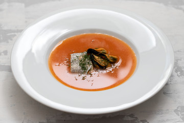 fish soup in white plate