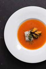 fish soup in white plate