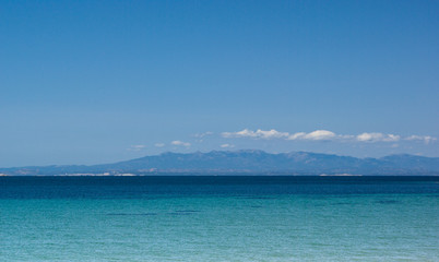 Beautiful and quiet beach  with turquoise sea  and blue sky in Porto Pollo, Sardinia 