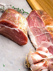 meat mix, Smoked ham, jerky corned beef on table with garlic, herbs