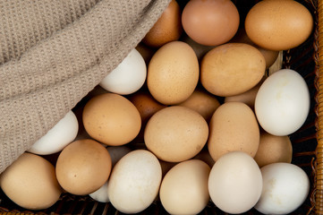 Top view of chicken eggs in a basket