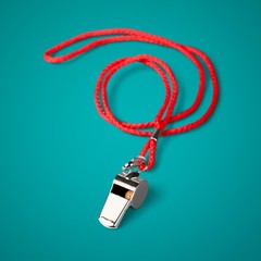 Sports whistle with a lace. It is isolated on a white background
