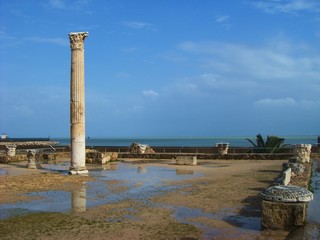 Carthage, Tunisia - April 12, 2018: Ruins of Bathhouse of Carthage and view to Mediterranean sea, Tunisia. UNESCO world heritage.