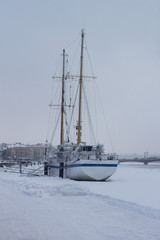 The ship winter on the river where the ice