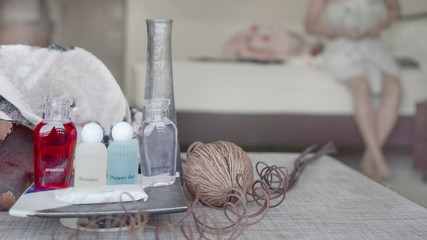 Bathroom accessories. Shower gel, shampoo and soap with towel