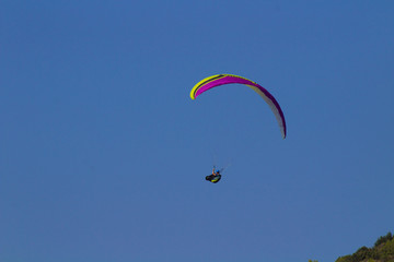 paragliding with blue clear sky on the background
