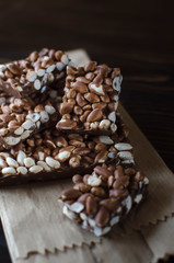 Chocolate with puffed rice bar on wooden table