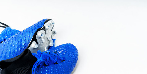 Pair of football soccer boots cleats shoes on a white background. Frame Football theme Long wide...