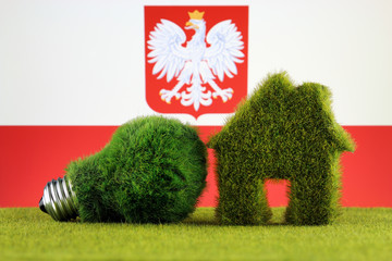 Green eco light bulb, eco house icon and Poland Flag. Renewable energy. Electricity prices, energy saving in the household.