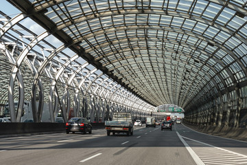 Expressway in Warsaw. Glass tunnel on the highway