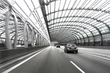 Expressway in Warsaw. Glass tunnel on the highway