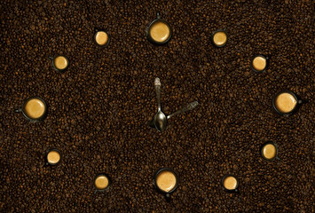 Hours from black mugs of coffee with on coffee beans. Hours from coffee. The concept time from food