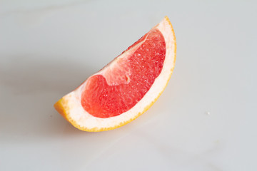 slice of pink grapefruit close up.