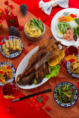 Beijing roasted duck or Peking roasted duck served on festive table for Chinese New Year celebration