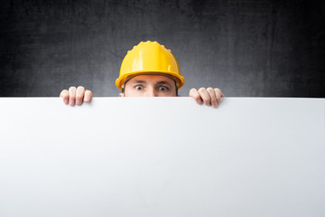 Worker holding blank board