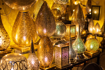 metal crafts in Marrakech. Gold, silver and copper lamp pieces in the Market