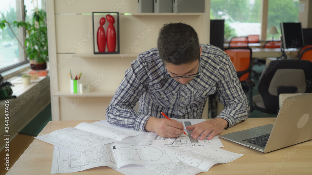 Aufkleber architect working with sketch on the table plan blueprint