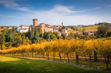 Naklejka premium Levizzano Rangone castle and wineyards on the foreground. Modena province, Emilia Romagna, Italy