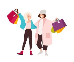 Pair of happy teenage girls carrying shopping bags. Smiling young women holding their purchases. Pair of shopaholics. Funny cartoon characters isolated on white background. Flat vector illustration.