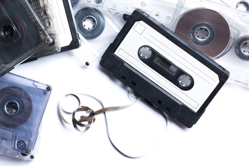 Old audio cassettes on white background