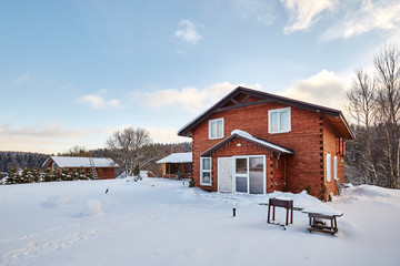 Winter house on winter snowy panoramic landscape