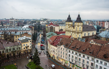 Fototapeta na wymiar Ivano-Frankivsk / Ukraine - November 26 2017: View of city center and city hall tower of western ukrainian city Ivano-Frankivsk