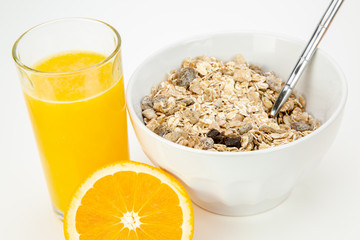 Balanced breakfast with muesli bowl and fresh orange juice