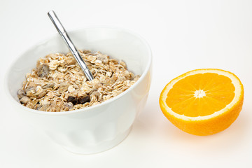 Balanced breakfast with muesli bowl and fresh orange juice