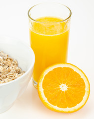 Balanced breakfast with muesli bowl and fresh orange juice