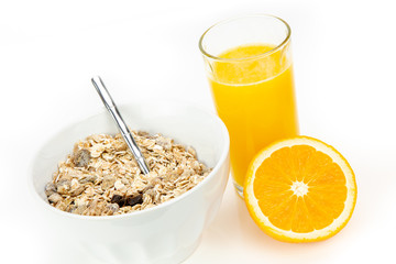 Balanced breakfast with muesli bowl and fresh orange juice