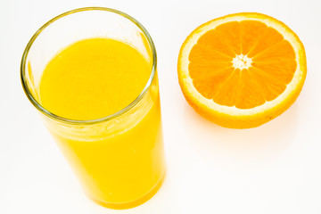 fresh orange juice and half orange isolated on white background