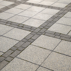 Figure out the paving slabs in the square. Background of paving