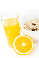 Balanced breakfast with muesli bowl and fresh orange juice
