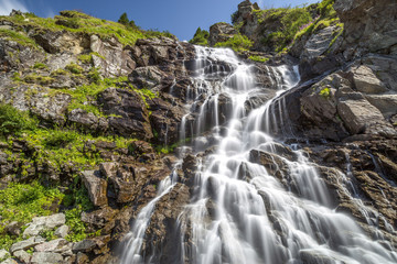 Fototapeta na wymiar Capra Waterfall located on famous road Transfagarasan in Romania