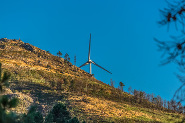 View of a wind turbine on top of mountains, in Portugal