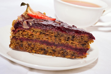 piece of carrot cake with cup of tea. close up