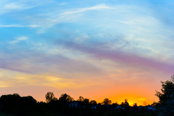 Fototapeta na wymiar Beautiful clouds in the rays of the sunset
