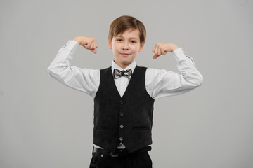 Little boy bragging about biceps